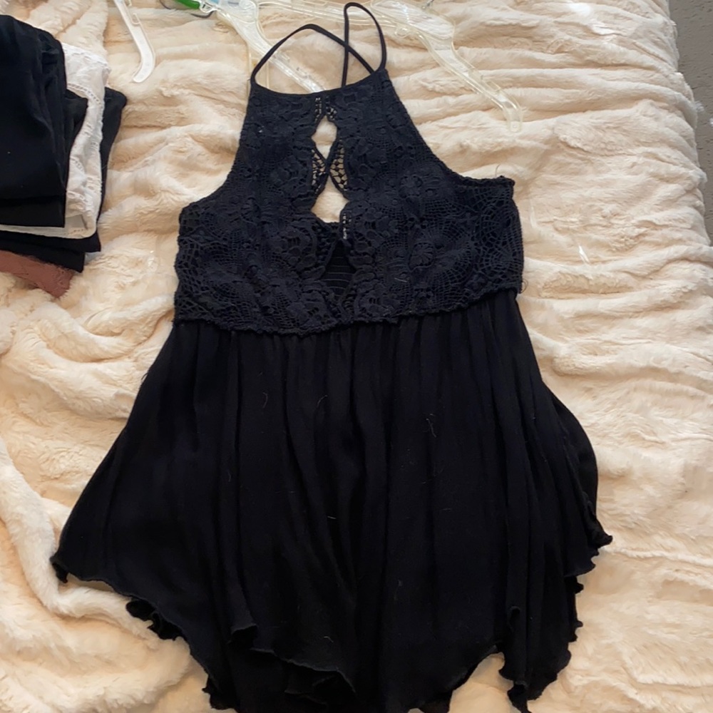 Black tank top, three triangle cut outs in front